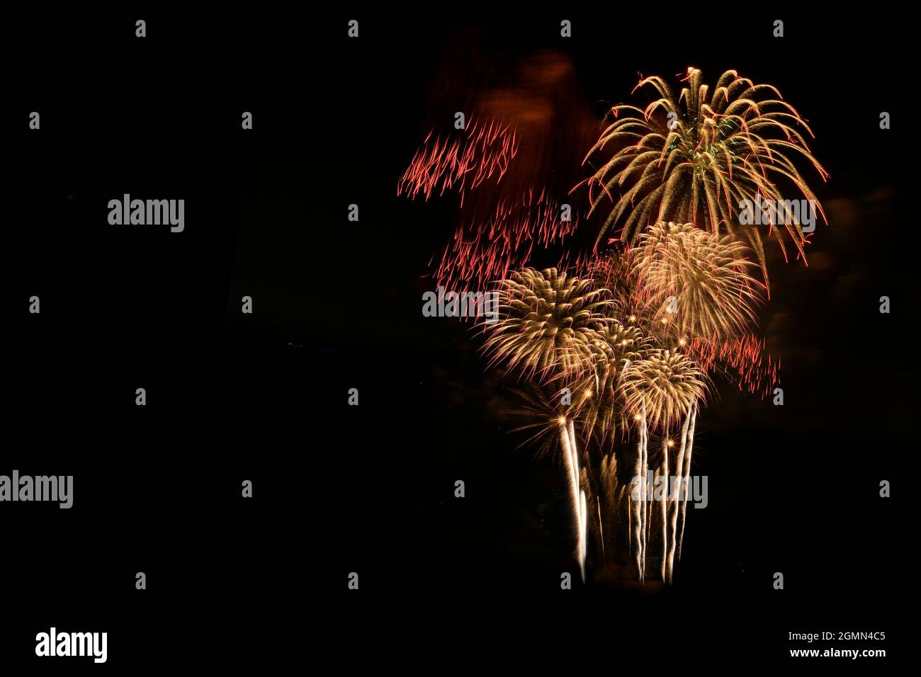 Colorful fireworks celebration and the night sky background. Group of fireworks isolated on black background. Stock Photo