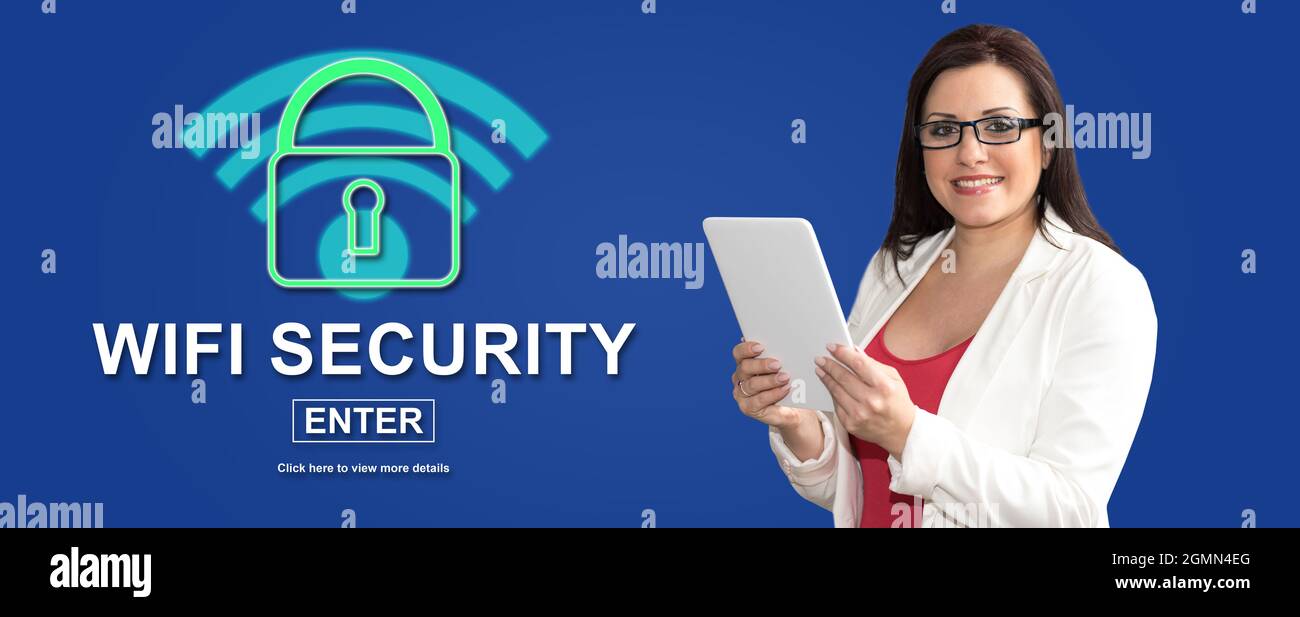 Woman using digital tablet with wifi security concept on background Stock Photo