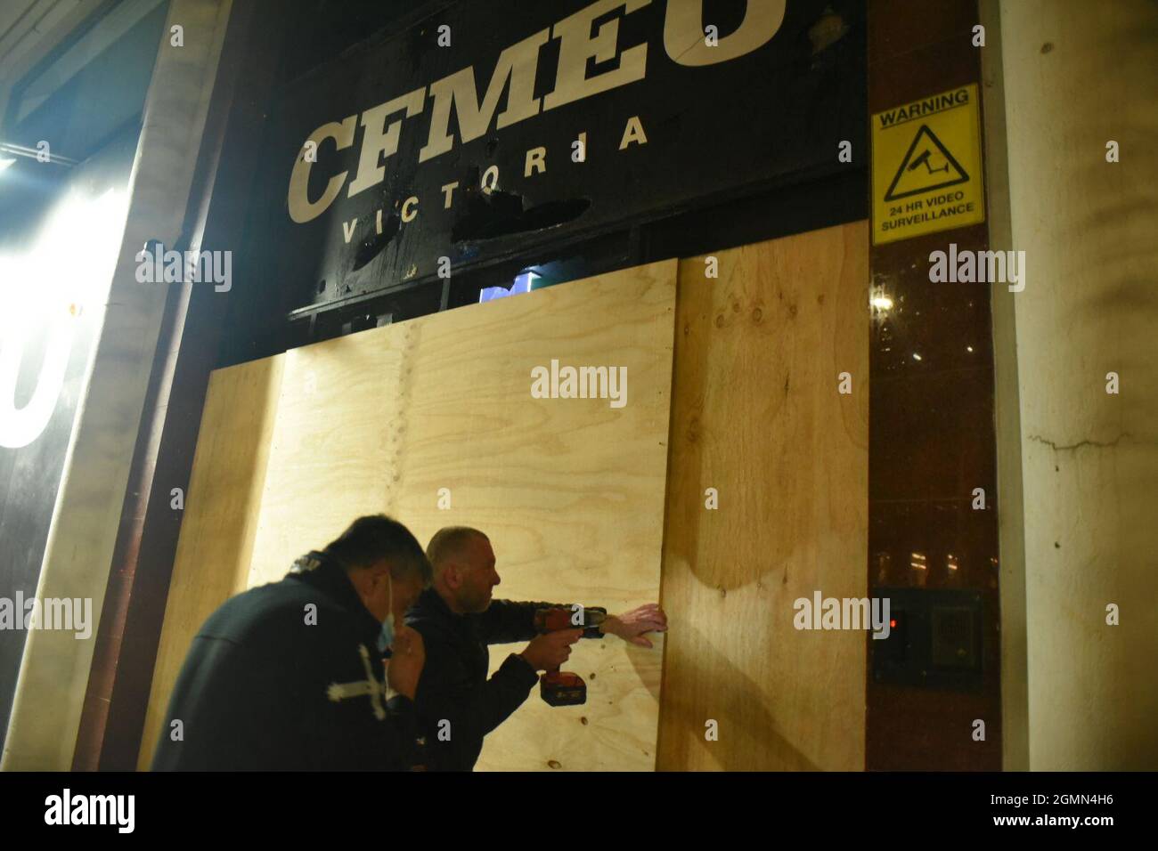 Melbourne, Australia. 20th September 2021. CFMEU members board up the union headquarters after extensive damage following a protest by trade workers over mandatory vaccinations. This comes after the annoucnent of another protest for the following day. Credit: Jay Kogler/Alamy Live News Stock Photo