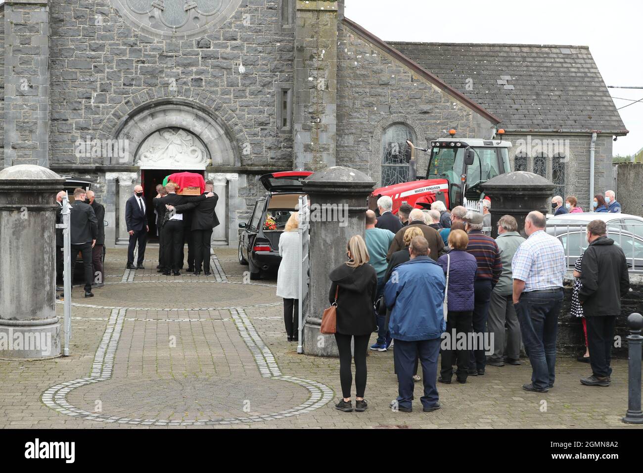 The coffins of Eileen and Jamie O'Sullivan are carried into St Michael ...