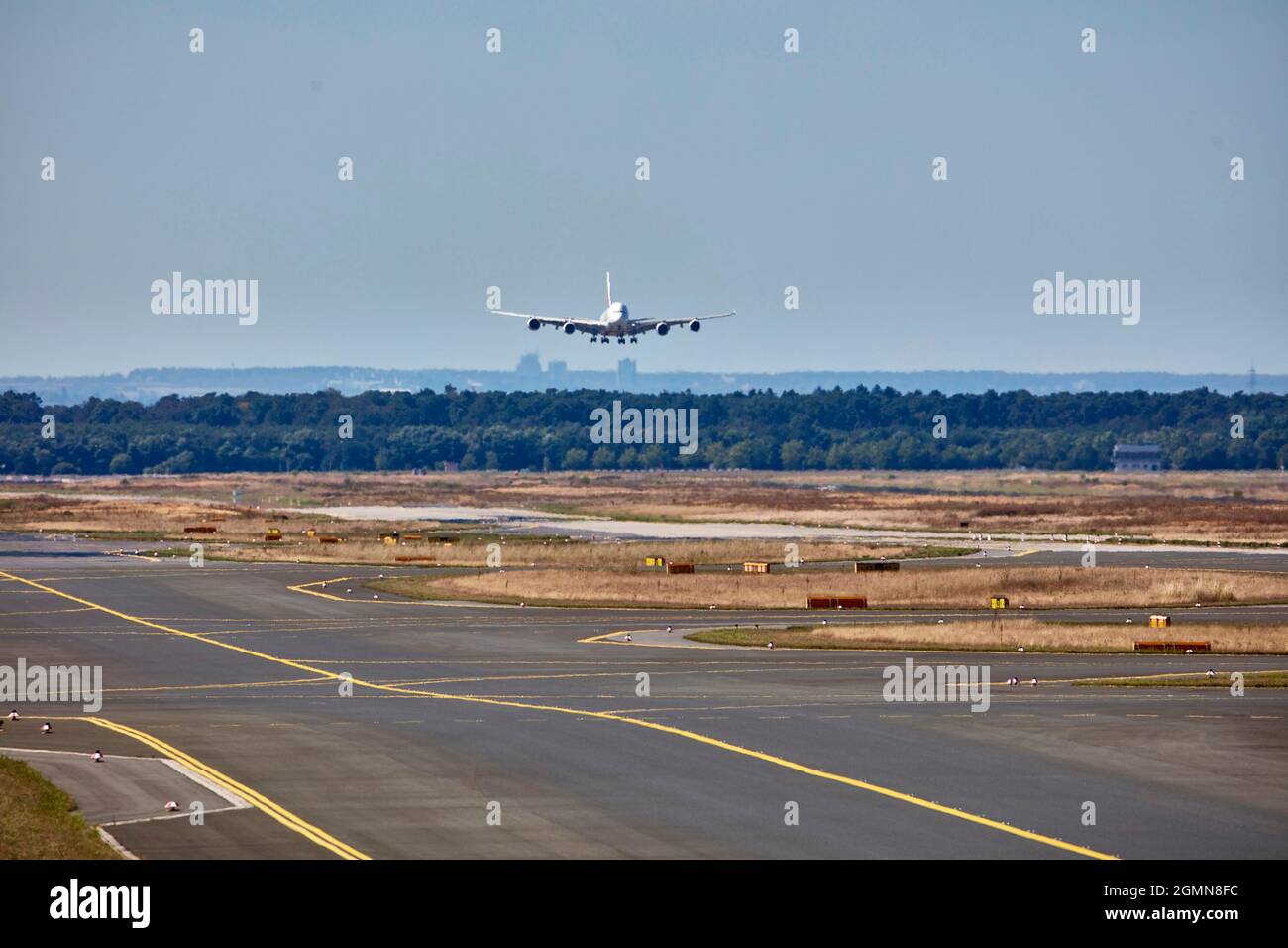 Airbus 380 approaching Frankfurt airport, because of the hot summer all grass is dried out and the air is flickering, Germany, Hesse, Flughafen Stock Photo