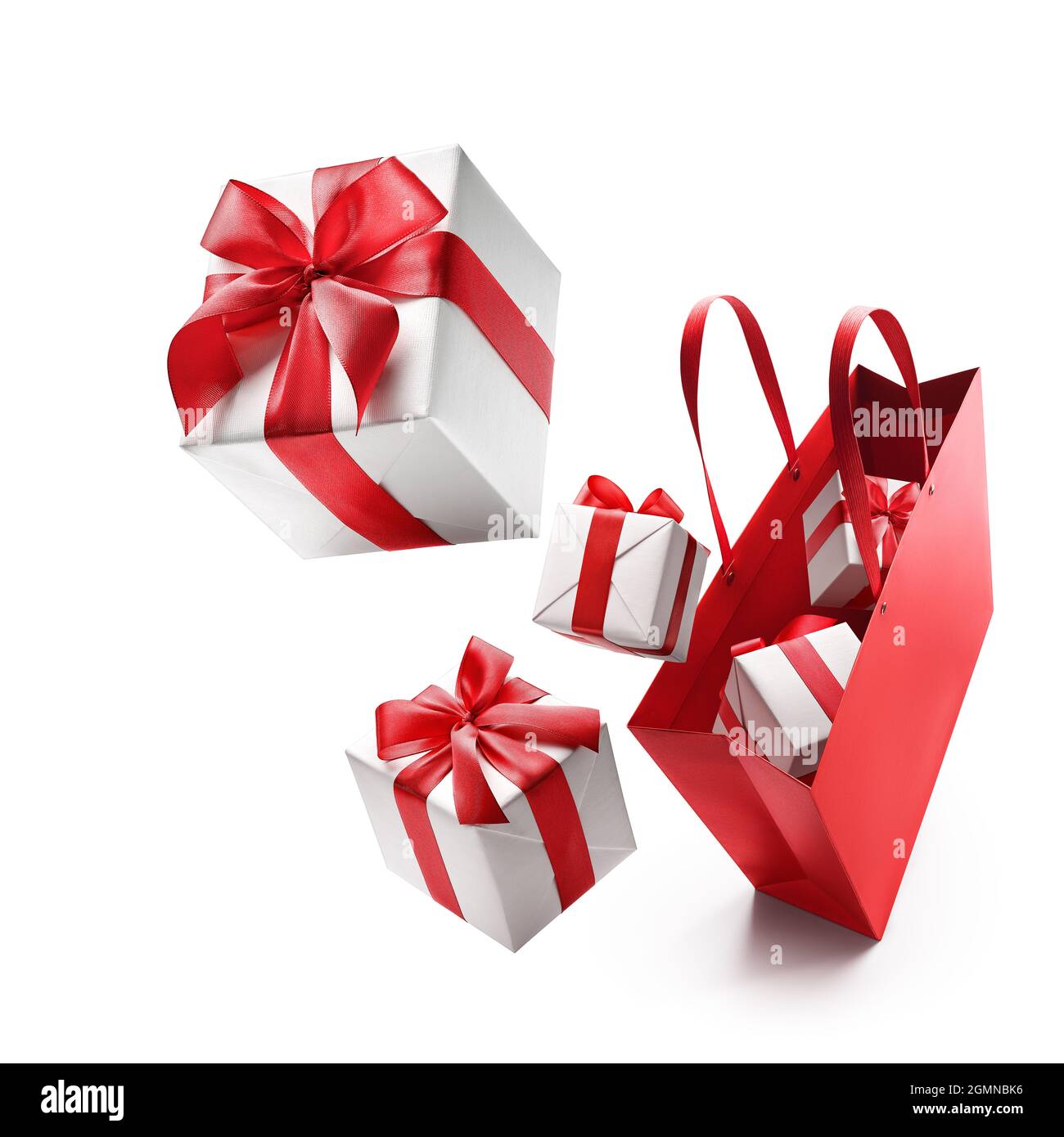 Christmas shopping - White color gift boxes pop out from red shopping bag Stock Photo