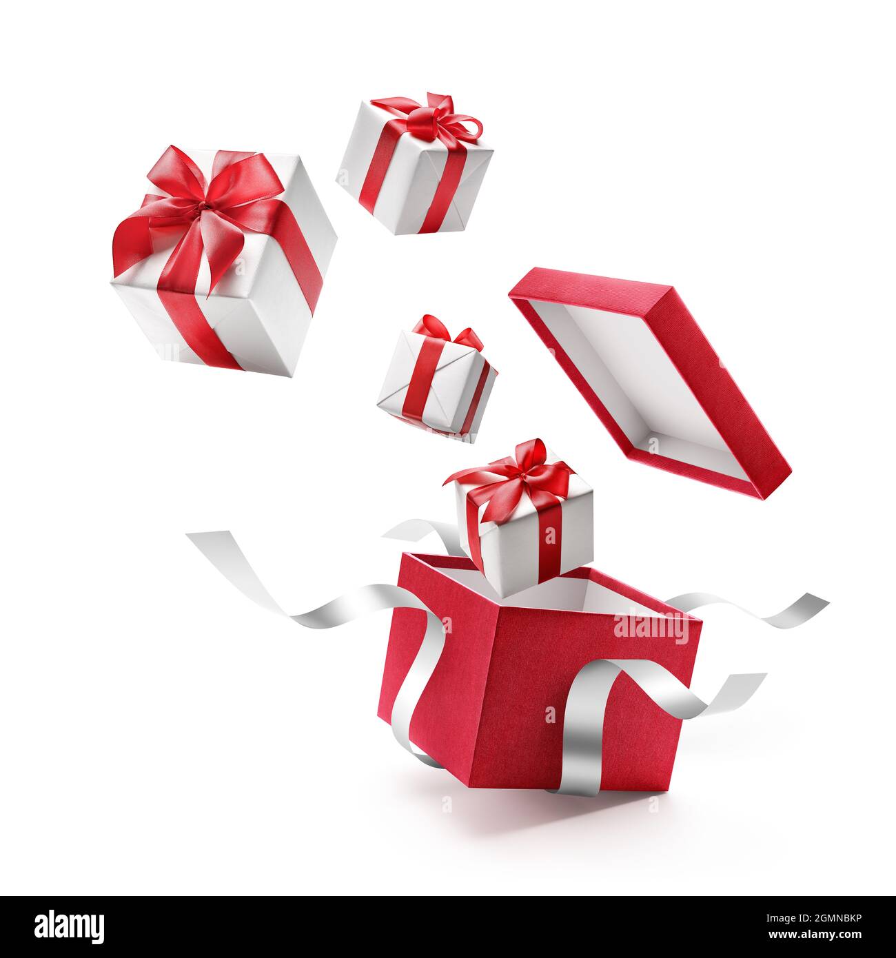 Gifts bursting out from red open gift box over white background Stock Photo