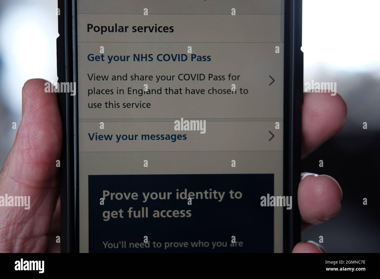 NHS covid vaccination pass on mobile phone Stock Photo