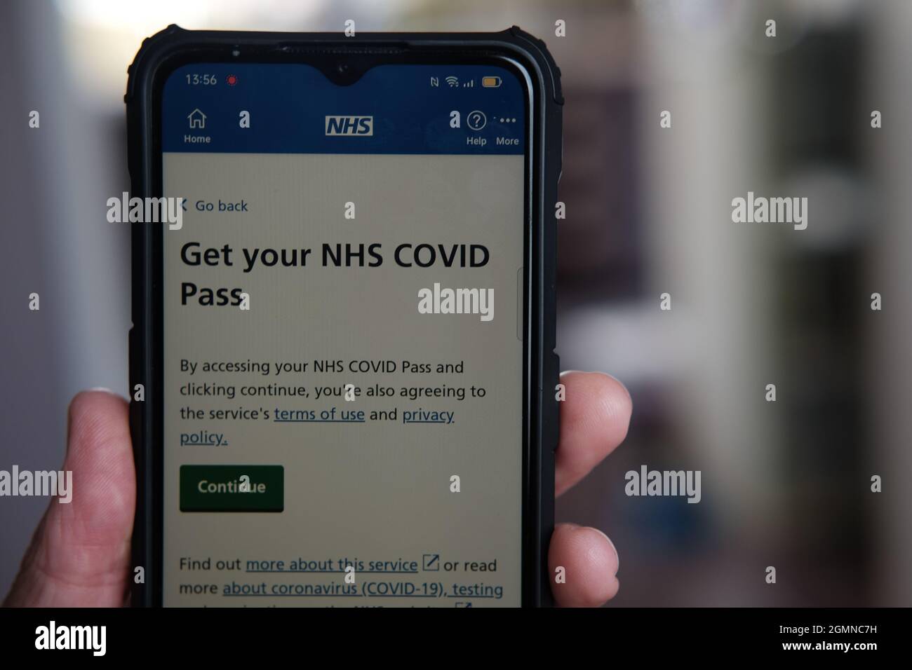 NHS covid vaccination pass on mobile phone Stock Photo