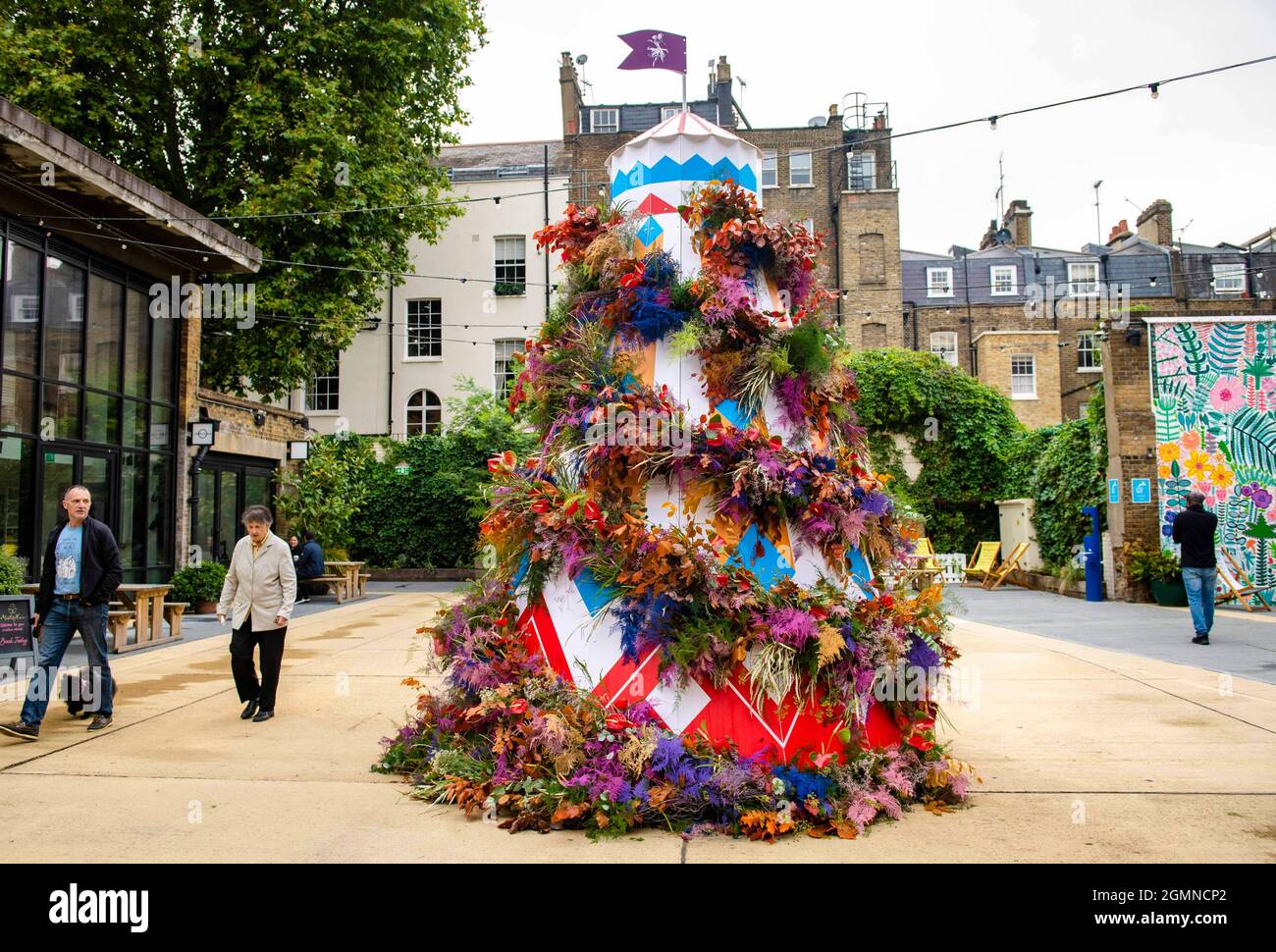 EDITORIAL USE ONLY A floral Helter Skelter installation in Eccleston Yards designed by florist Moyses Stevens for the Belgravia in Bloom festival, running from September 20-26, London. Picture date: Monday September 2021. Stock Photo