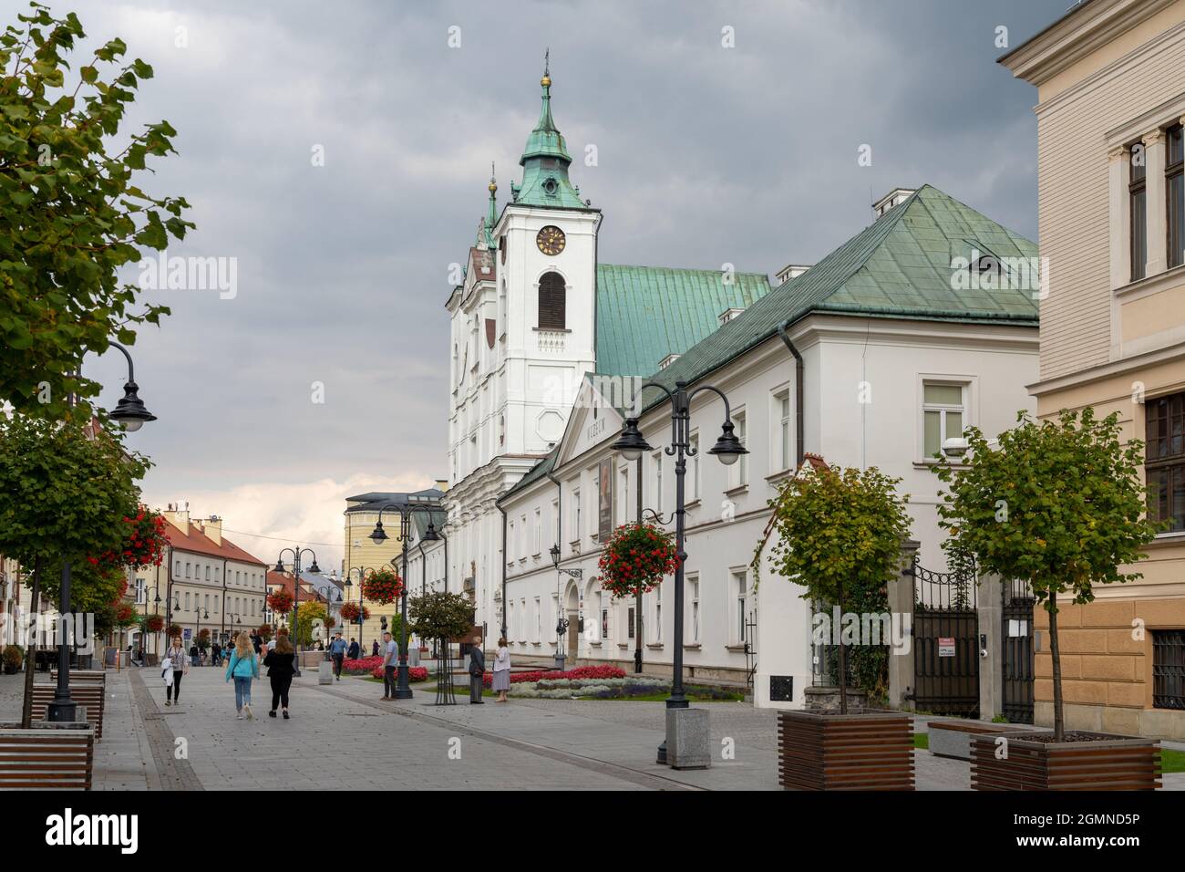 Rzeszow, Poland - 14 September, 2021: view of the 3 Maja Street in downtown Rzeszow with ist many restaurants and shops and the historic Catholic Chur Stock Photo