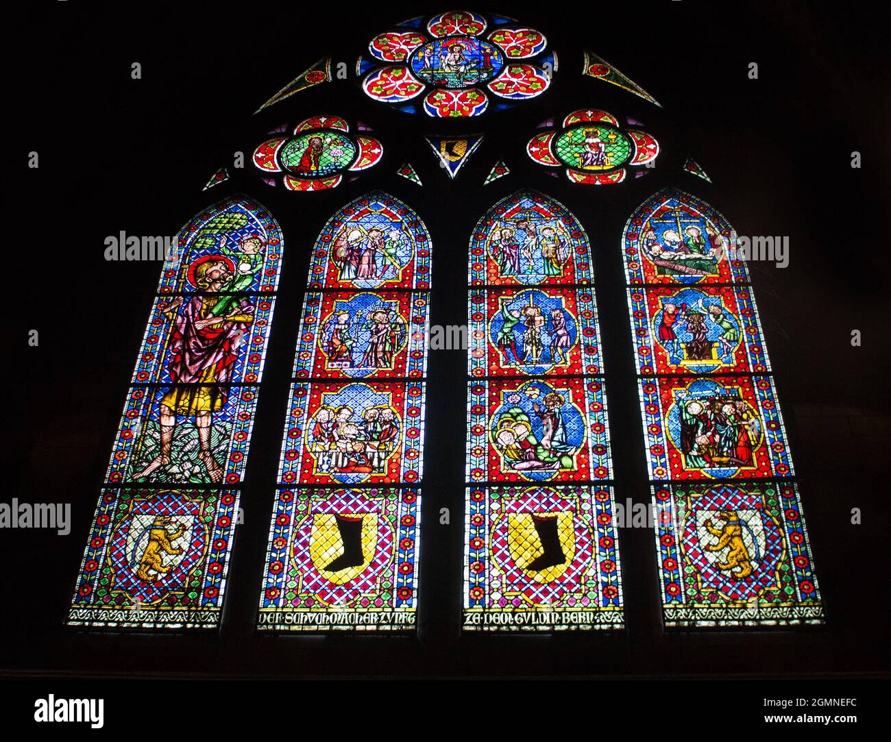 One of the many guild -sponsored stained glass windows in Freiburg Minster, Freiburg im Breisgau, Baden - Wurttemberg, Germany Stock Photo