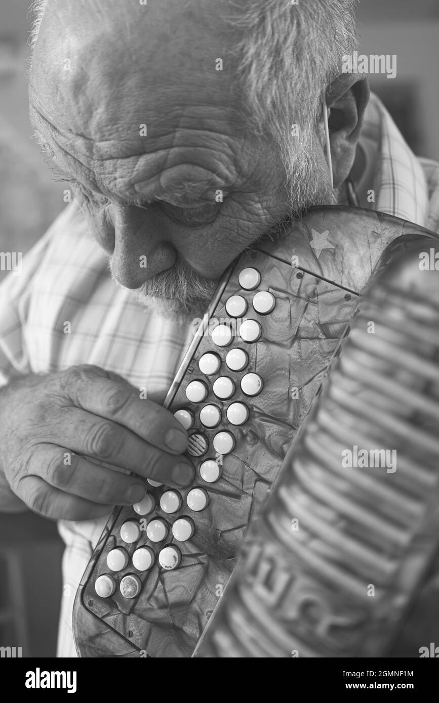 OLZA, ITALY - Aug 29, 2021: A portrait of Francesco Bonomini, a traditional organ harmonica player Stock Photo