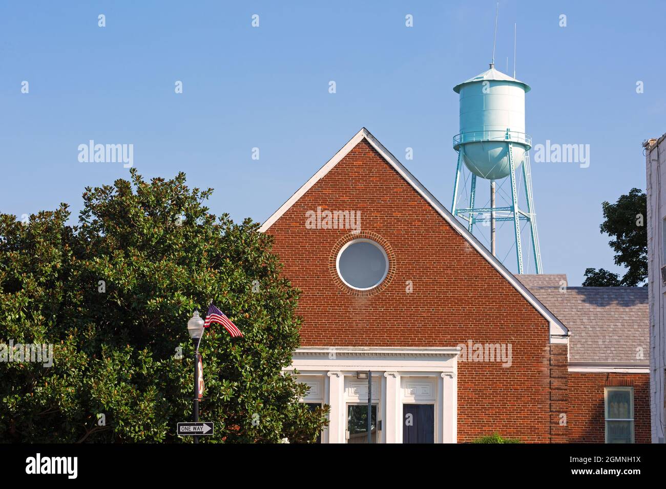 Building and water tower in a small USA town Stock Photo - Alamy
