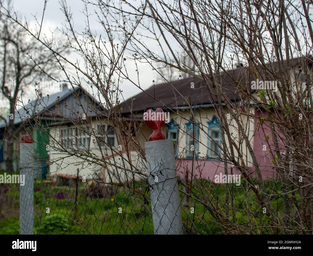 fence posts in the village, in the spring Stock Photo