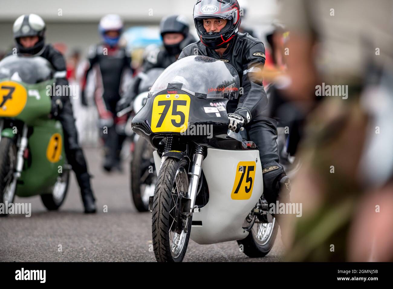 Goodwood, UK. 19th Sep, 2021. The Norton Manx 30M ridden by Josh Brooks and John Leigh Pemberton leaving the assembly area in the Barry Sheen Memorial Trophy at the Goodwood Revival Festival at the Goodwood Circuit, Sussex, UK on 19 September 2021. Photo by Phil Hutchinson. Editorial use only, license required for commercial use. No use in betting, games or a single club/league/player publications. Credit: UK Sports Pics Ltd/Alamy Live News Stock Photo