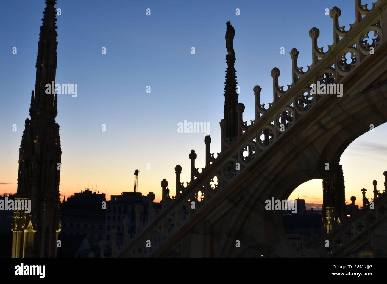 Sunset in background from rooftop of Duomo Di Milano Stock Photo
