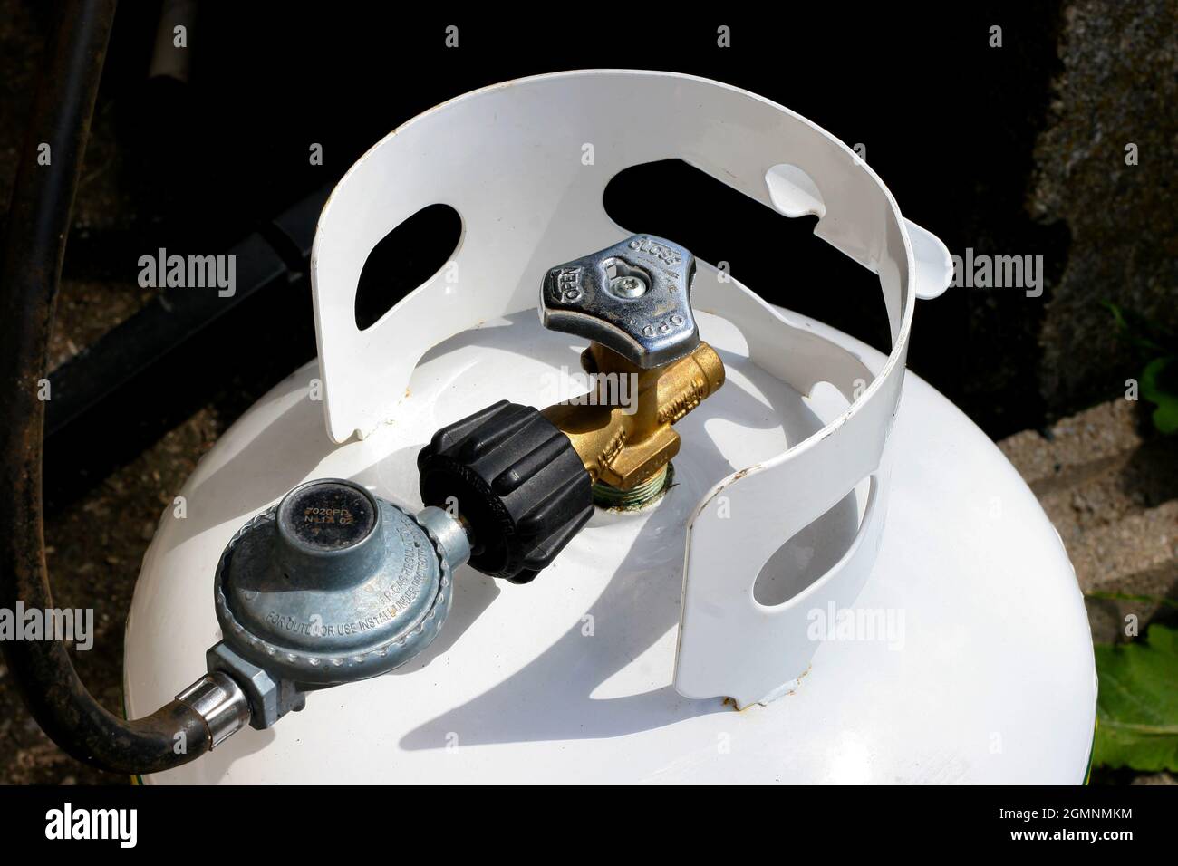 Propane tank and valve hooked up to a barbecue Stock Photo Alamy