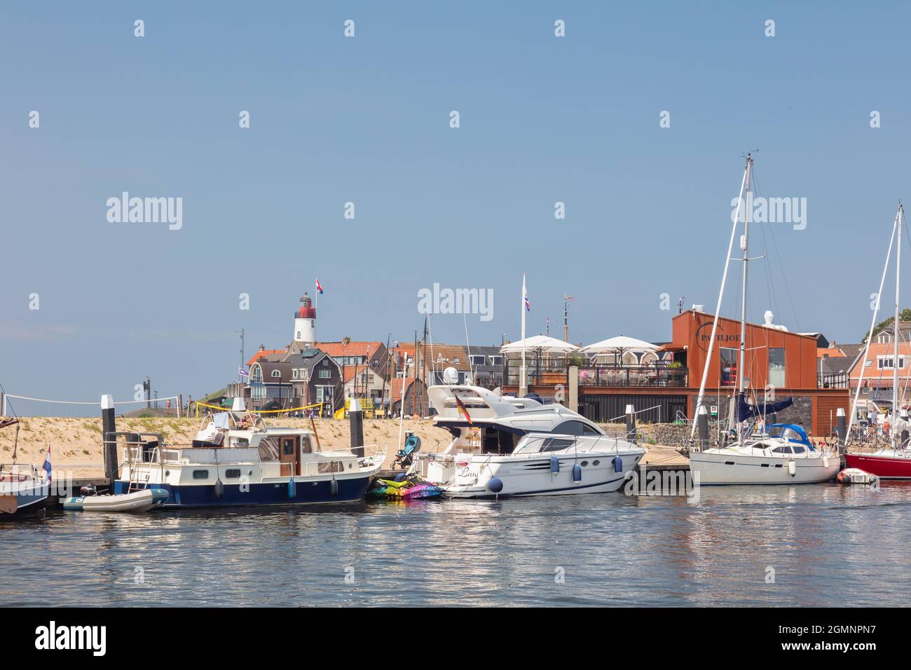 Urk, The Netherlands - July 7, 2021: Summer view of the Dutch harbour with yachts and sailboats in Urk, The Netherlands Stock Photo