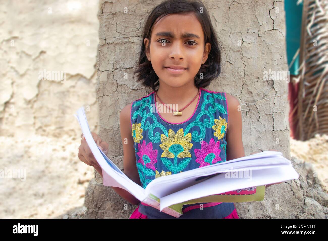Indian rural girl reading book at home Stock Photo Alamy