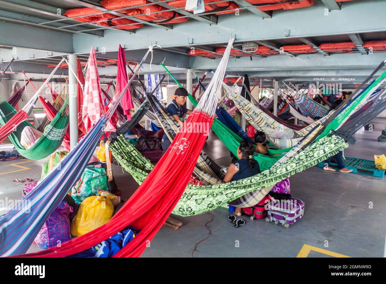 AMAZON, BRAZIL - JUNE 23, 2015: Passengers of hammock deck at the boat Diamante which plies river Amazon between Tabatinga and Manaus, Brazil. Stock Photo