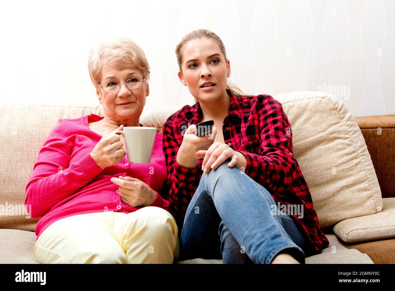 Couple sitting on couch man hi-res stock photography and images - Alamy