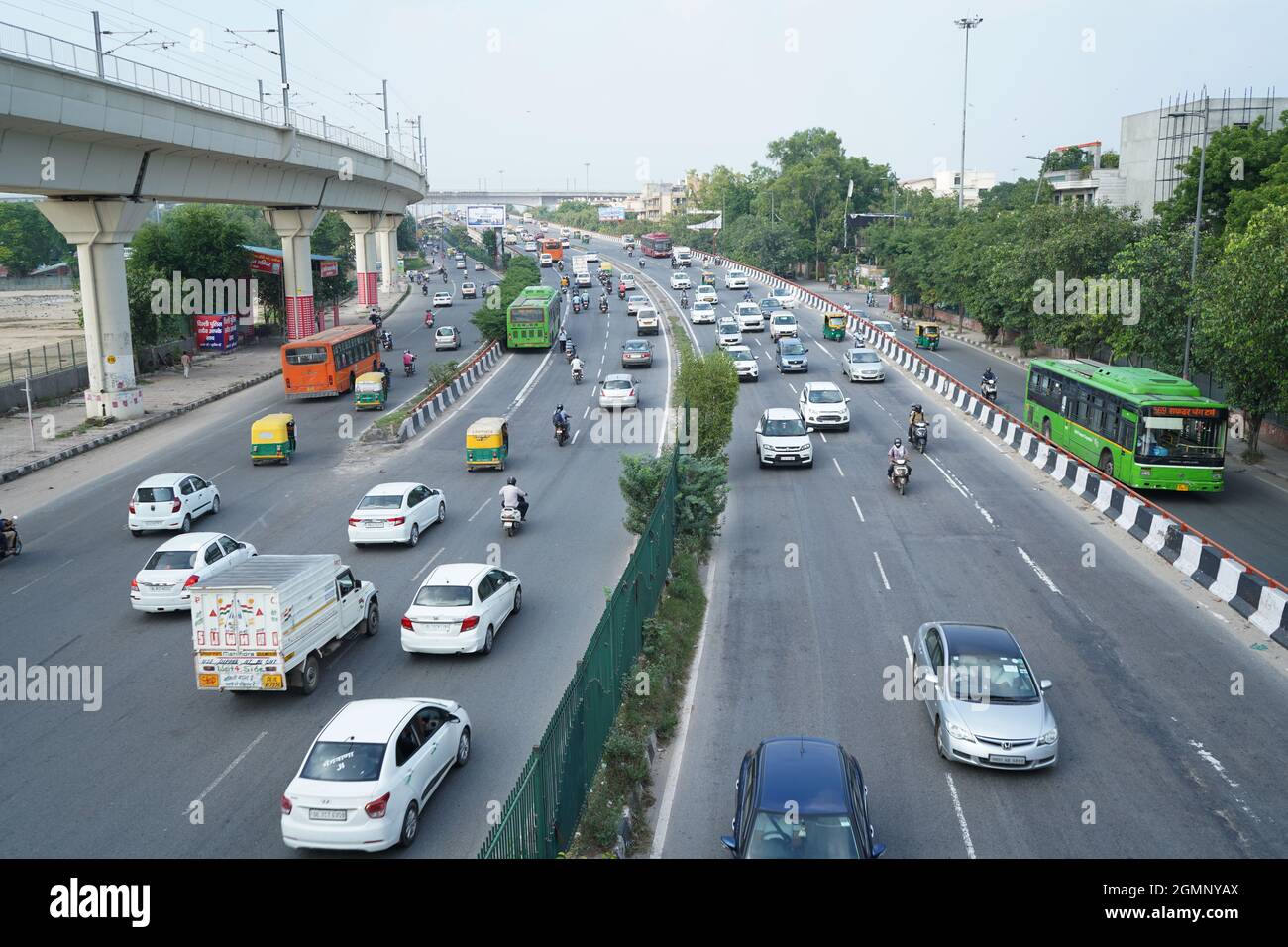 Delhi, india - September 9, 2020: traffic running on two lane road in new delhi, india Stock Photo