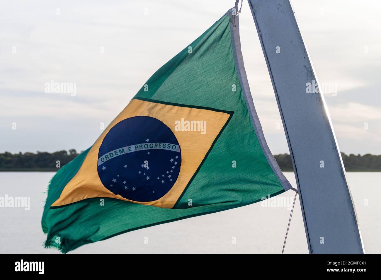 Flag of Brazil on a river boat on Amazon river Stock Photo