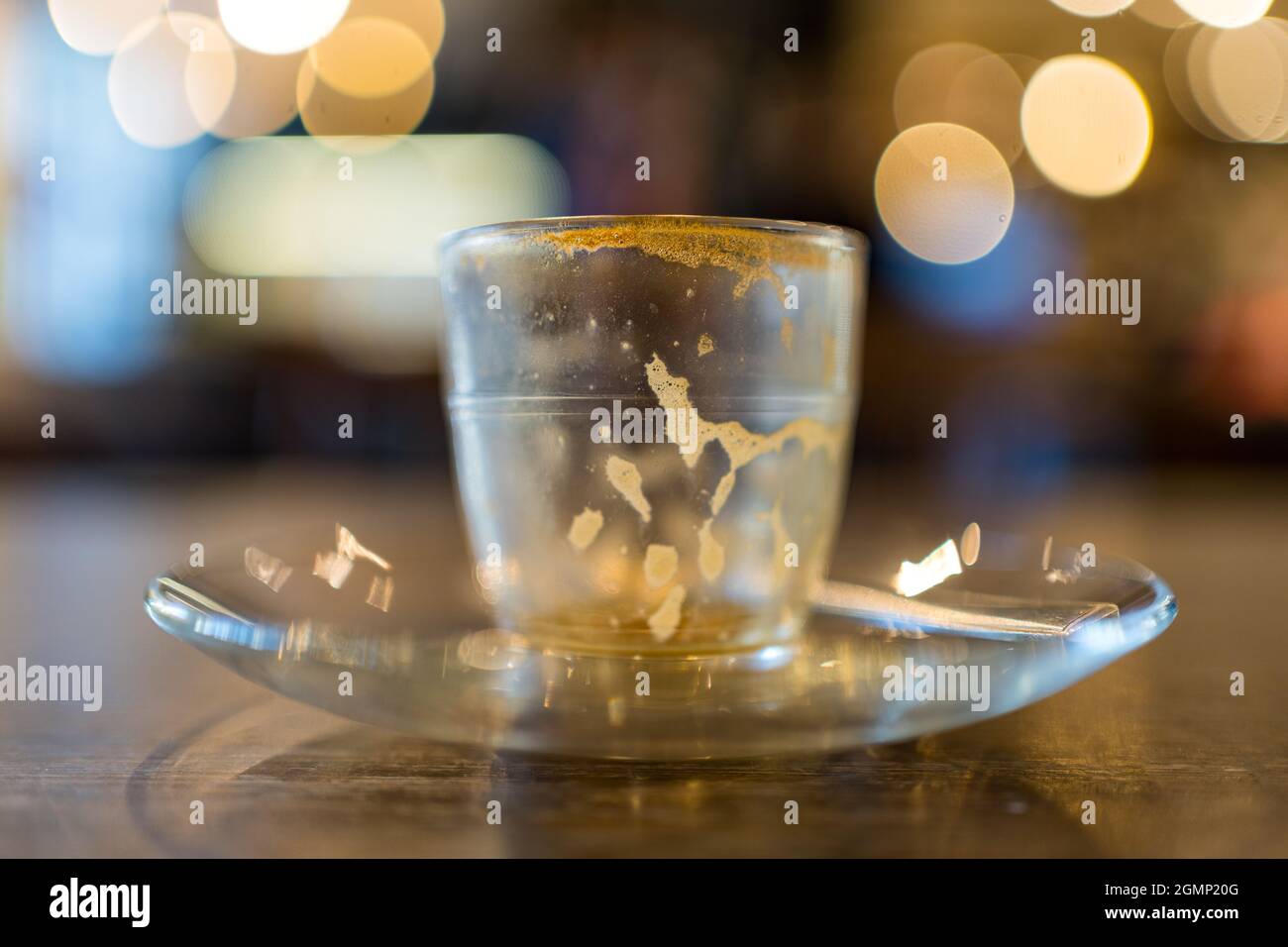 Coffee cup full and empty, blurred background, Artshop and Chapel, Abergavenny, Monmouthshire, Wales, UK Stock Photo