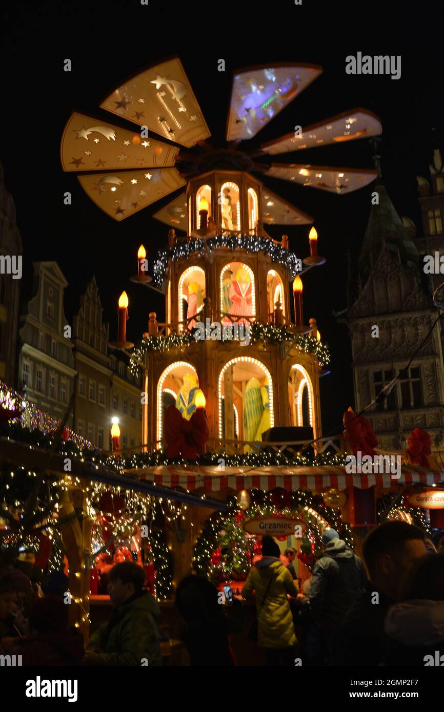 Christmas pyramid in front of the city hall of Wroclaw in the evening - Poland. Stock Photo