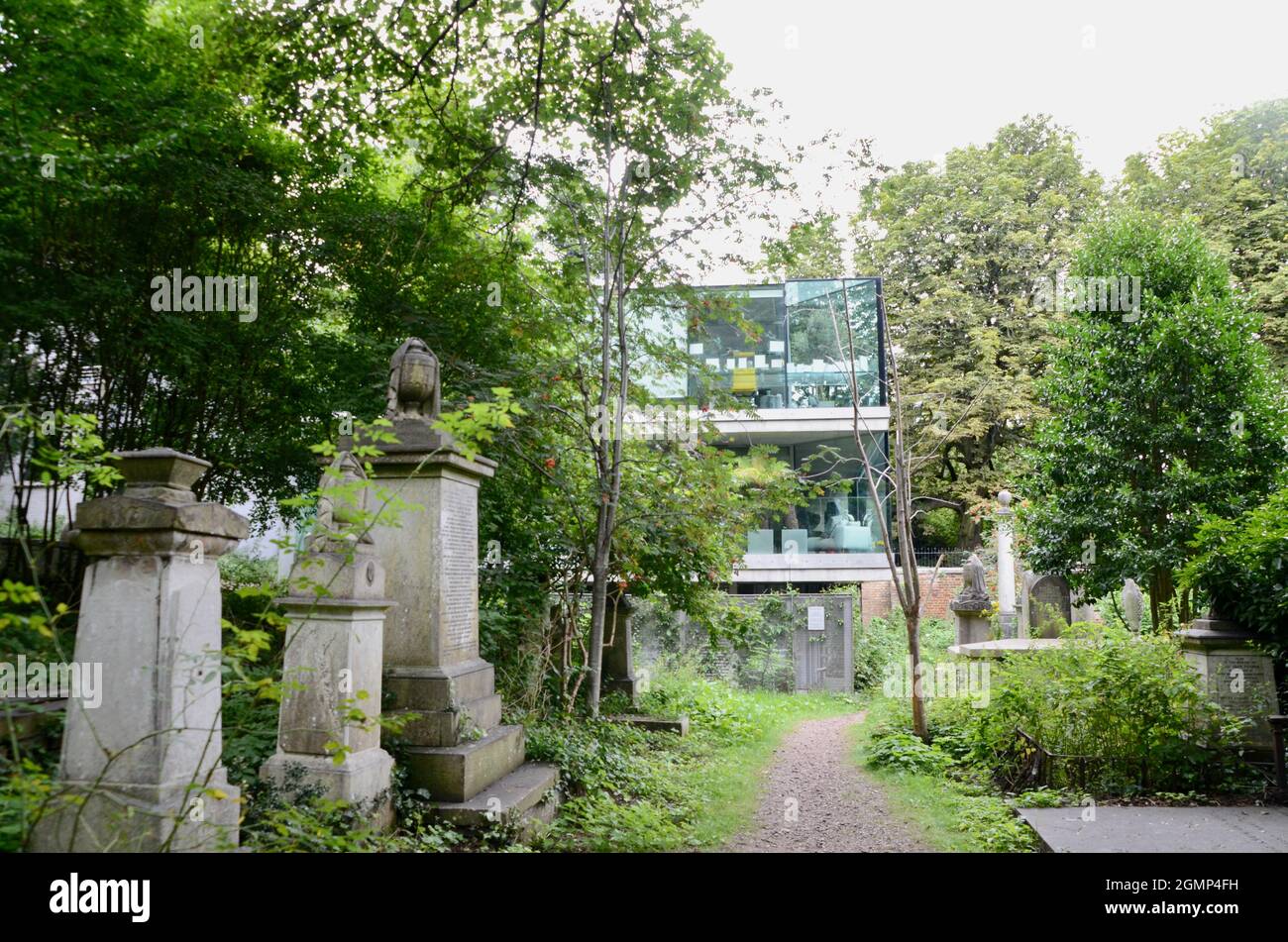 modern glass house built within highgate cemetery west swains lane N6