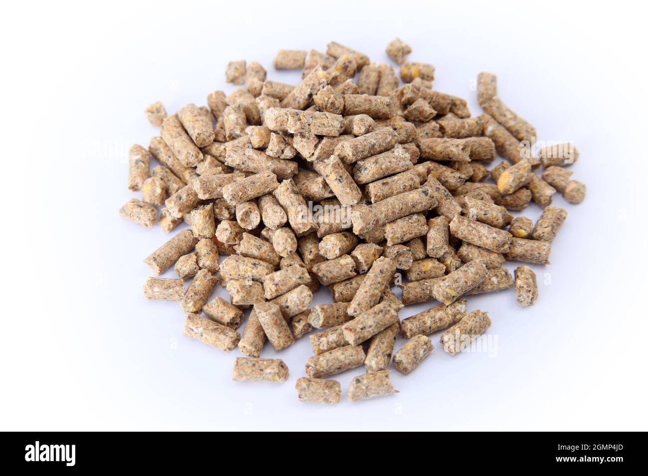 Pile of compound feed pellets isolated on white.   Animal feed. Stock Photo