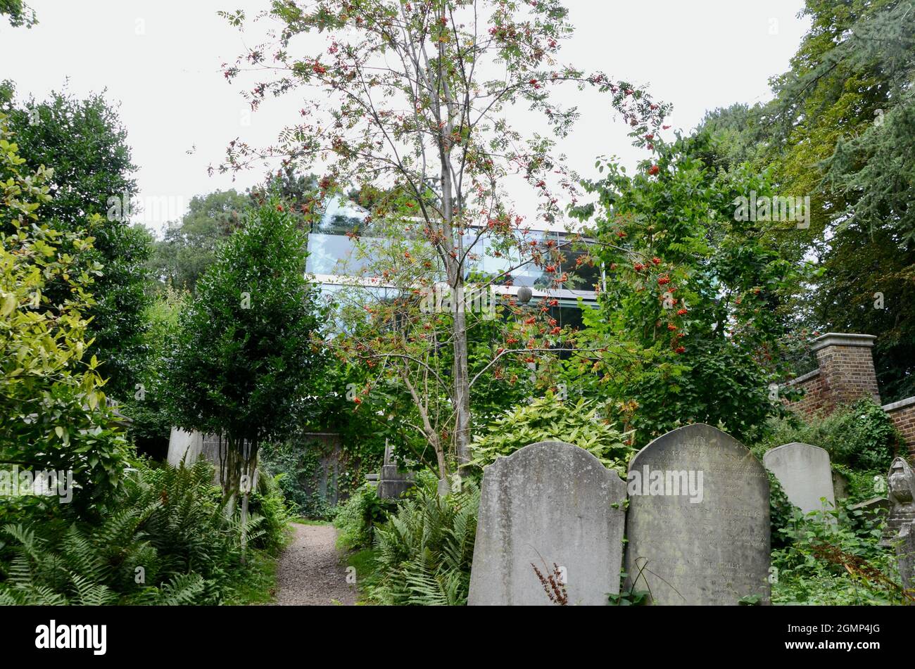 modern glass house built within highgate cemetery west swains lane N6