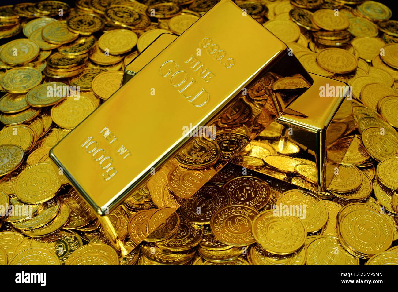 Gold bullion on pile golden coins a lot of Stock Photo Alamy