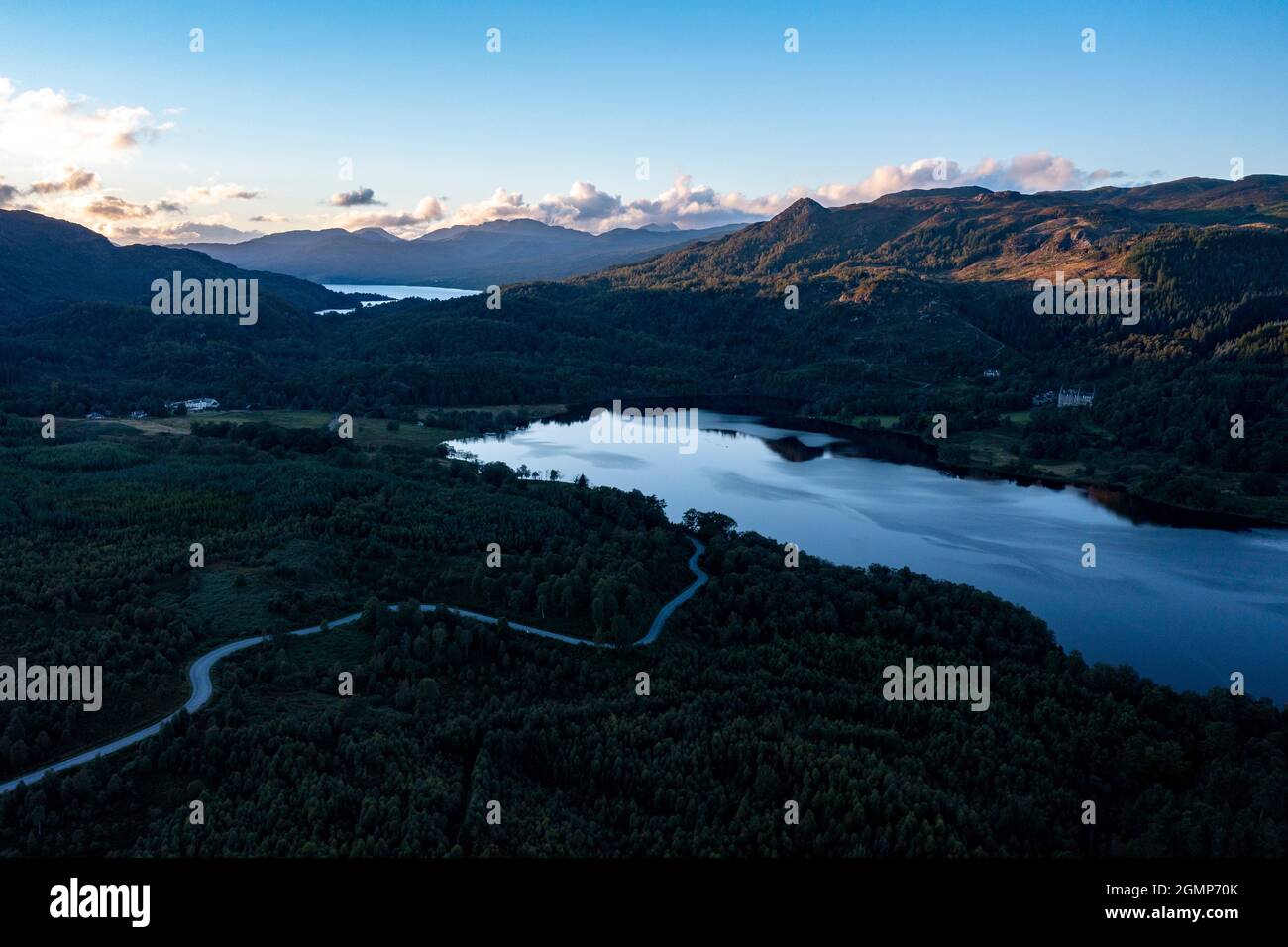 Loch Achray, Aberfoyle and Loch Achray, Loch Lomond and Trossachs National Park, Scotland, UK. 19th Sep, 2021.  PICTURED: Drone view Loch Achray and on of the road known as Dukes Pass which is the A821 linking the very popular tourist Heart 200 Route. This is a busy with outdoor enthusiasts and day trippers looking to escape the city and get into scenic Scottish countryside.  Credit: Colin Fisher Stock Photo