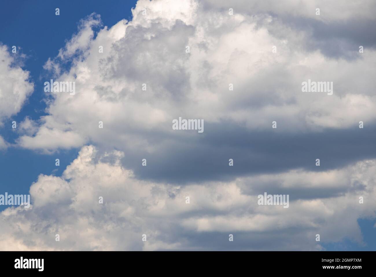 blue sky with white fluffy clouds in bright day Stock Photo - Alamy
