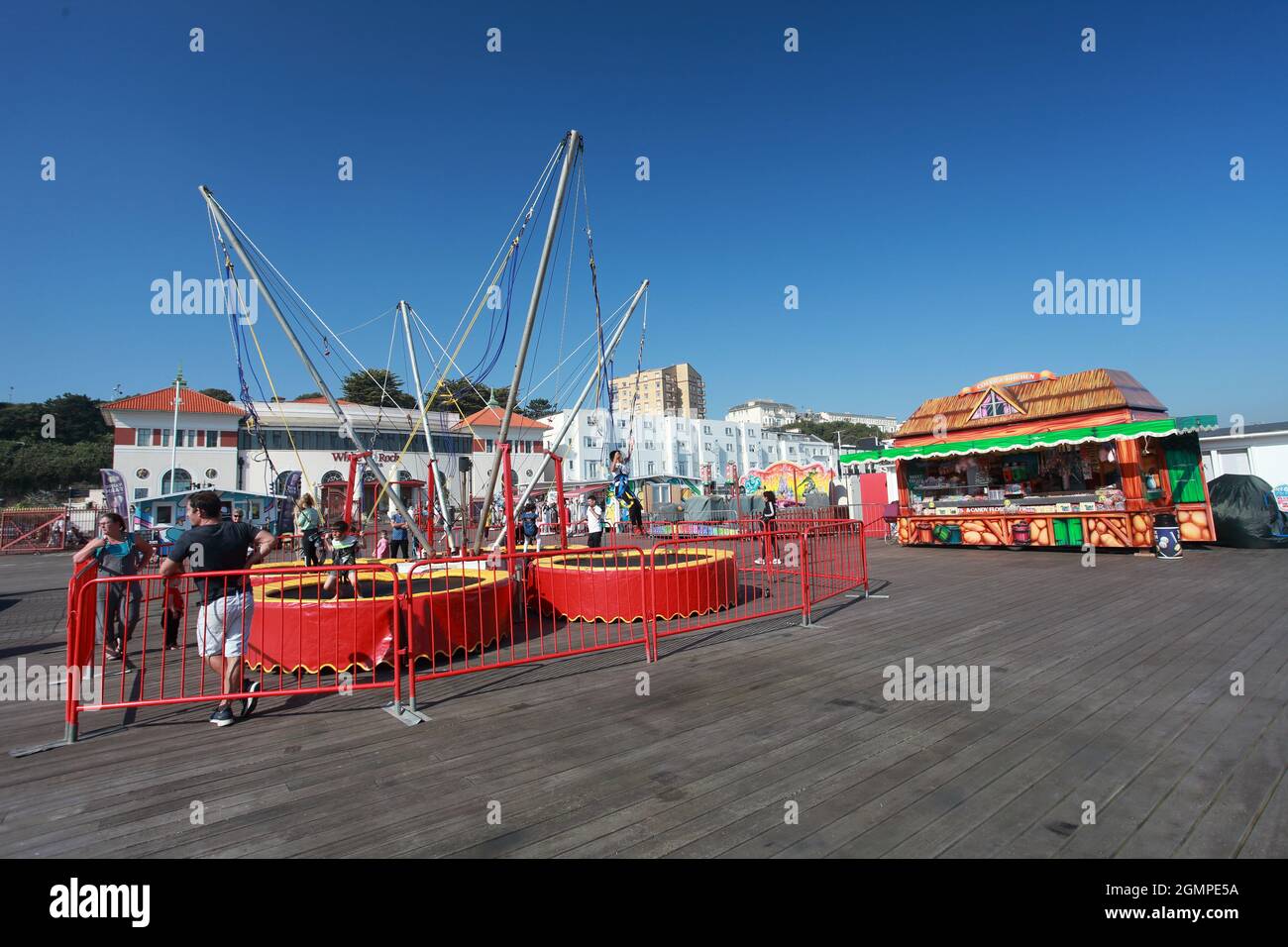 Kids having fun on bungee trampolines, Hastings Pier, Hastings, East