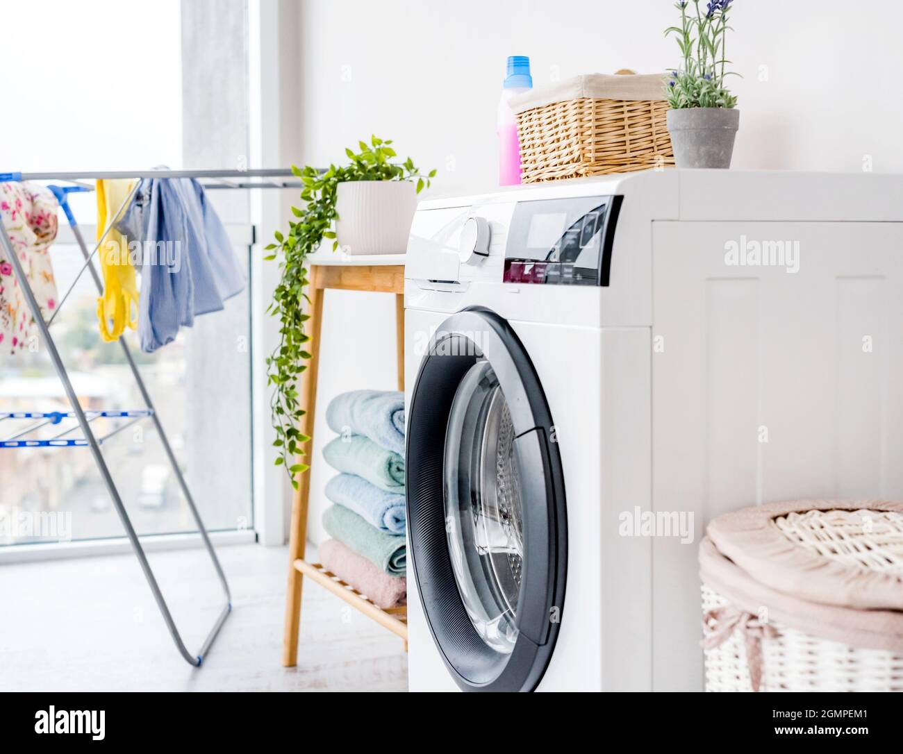 Washing machine laundry in bathroom Stock Photo Alamy