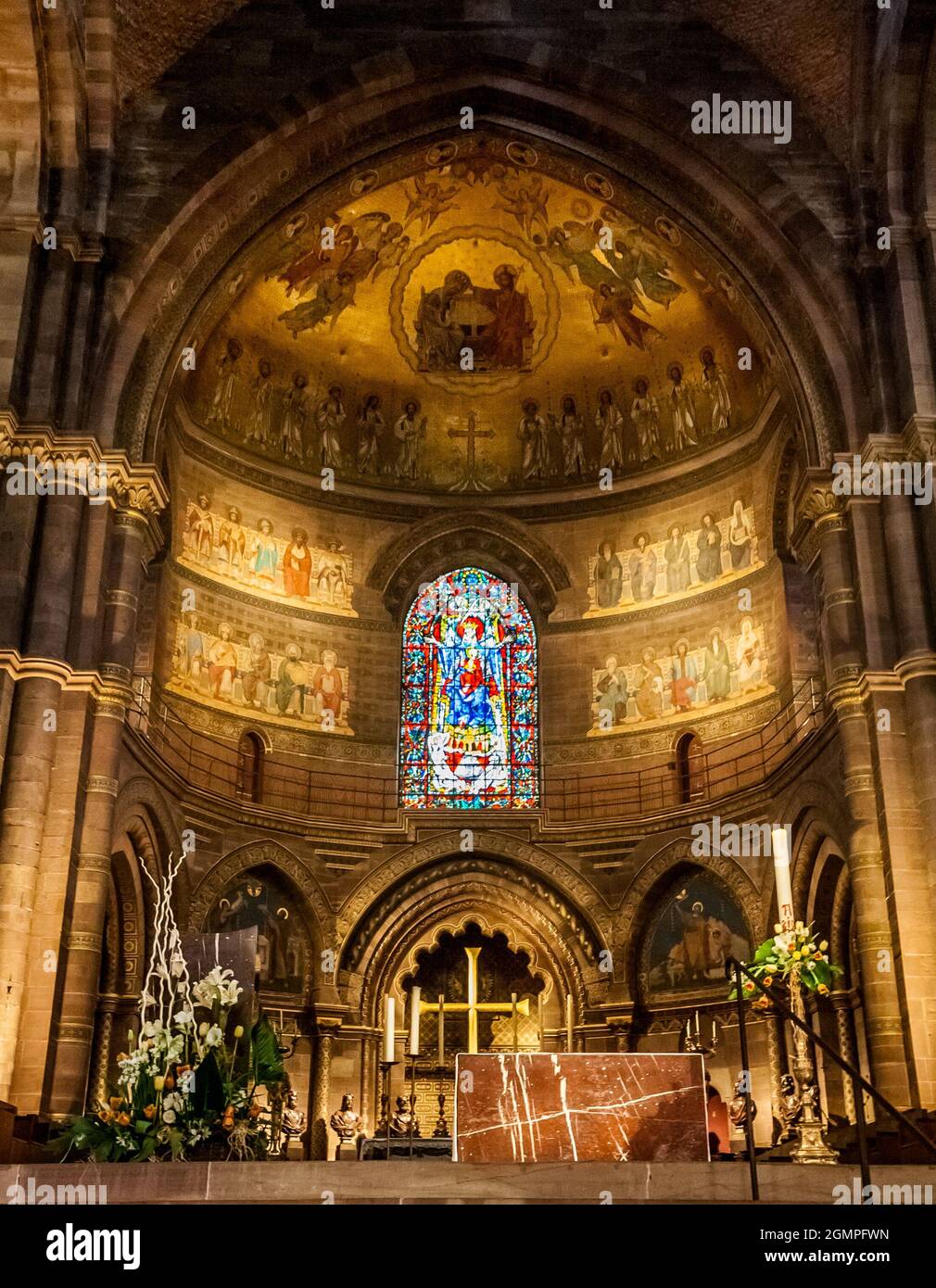 Great view of the choir on the northeast end, the apse with the Virgin of Alsace window and the main altar inside the famous Strasbourg Cathedral de... Stock Photo