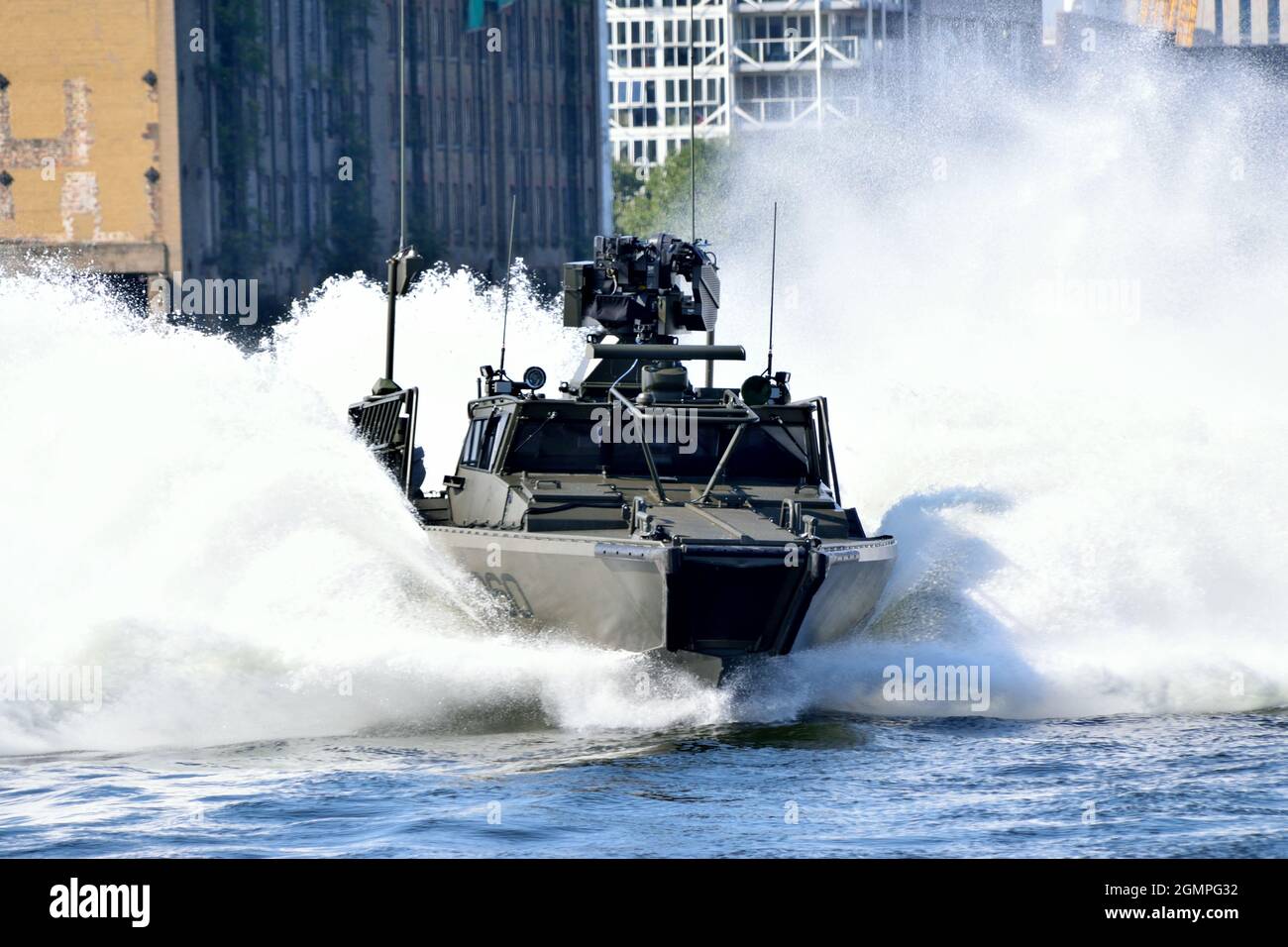 Swedish Navy CB90 NG patrol boat undertaking hard and fast maneuvering in Royal Victoria Dock in London as part of DSEI 2021 event Stock Photo