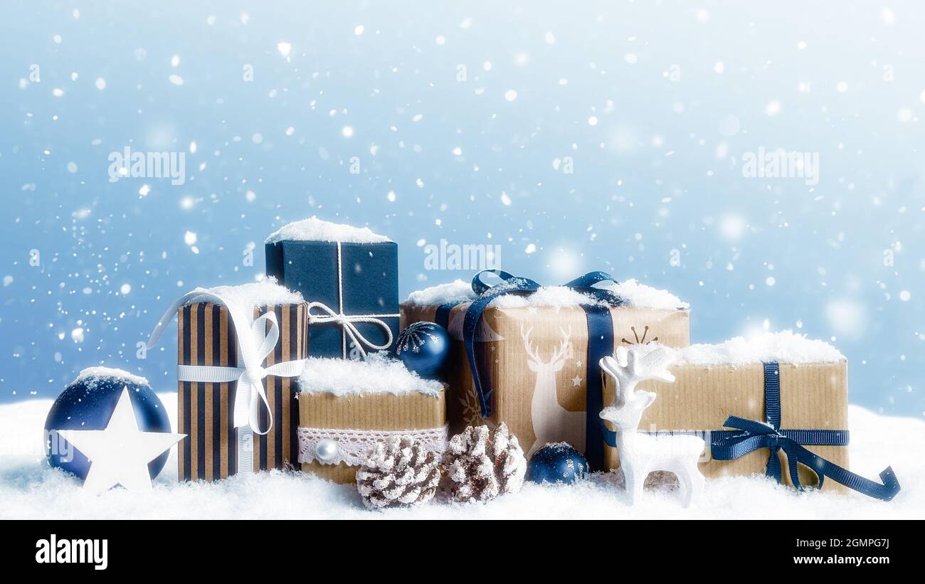 Christmas gift boxes covered by snow Stock Photo Alamy