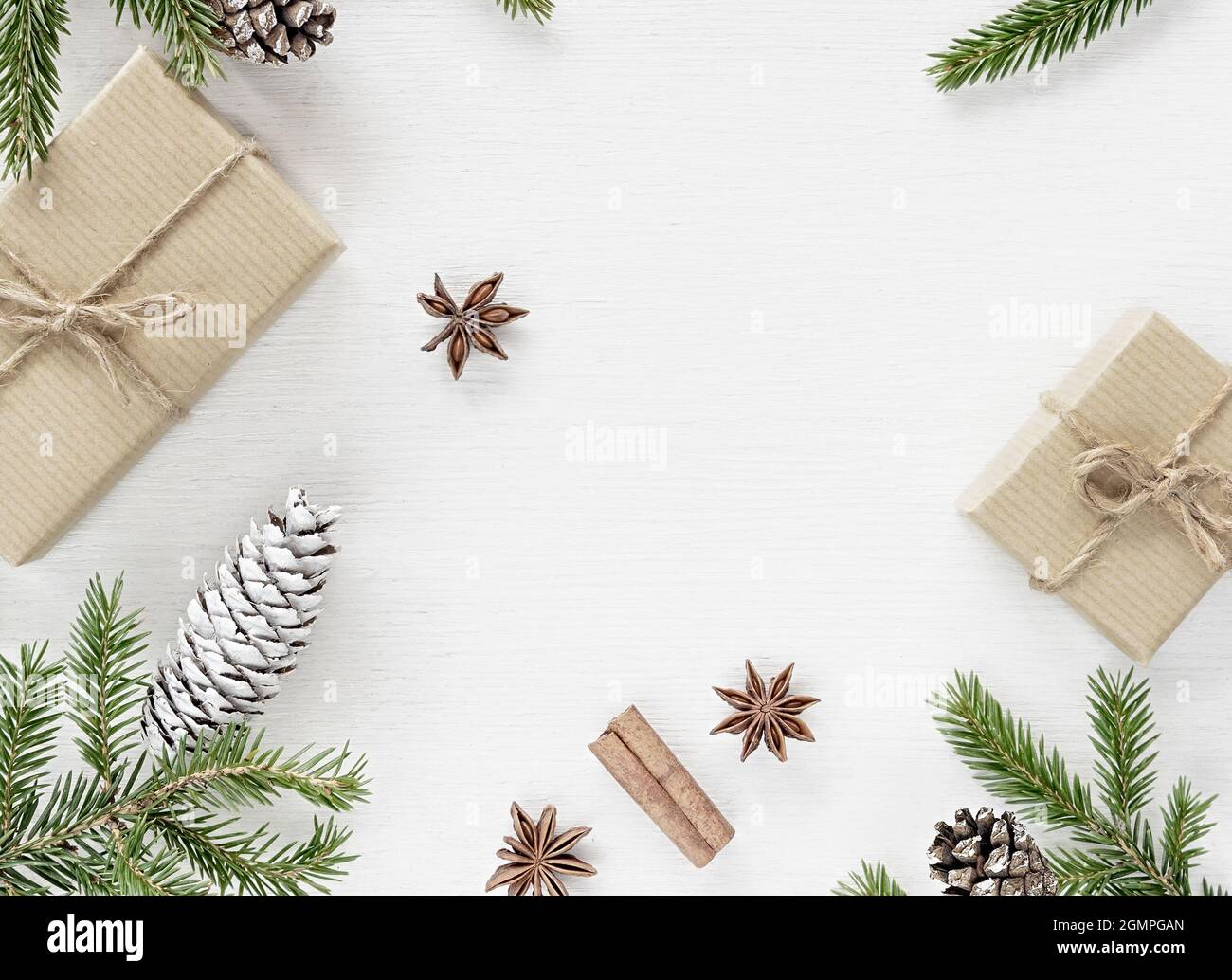 Christmas Composition with gift boxes wrapped in kraft paper, fir ...