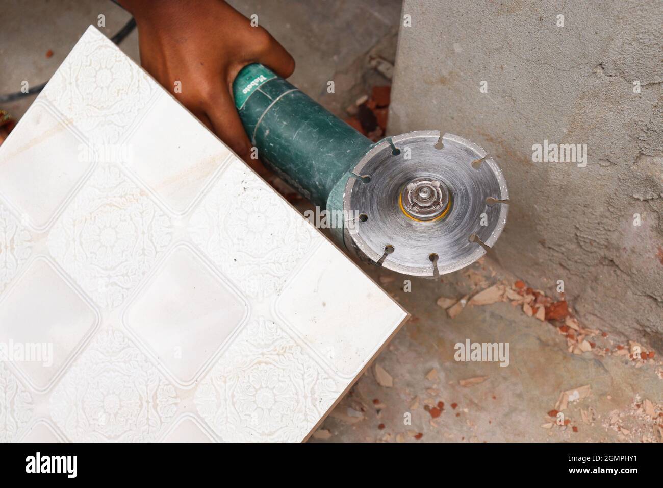 tile cutter machine with blade in house with worker Stock Photo - Alamy