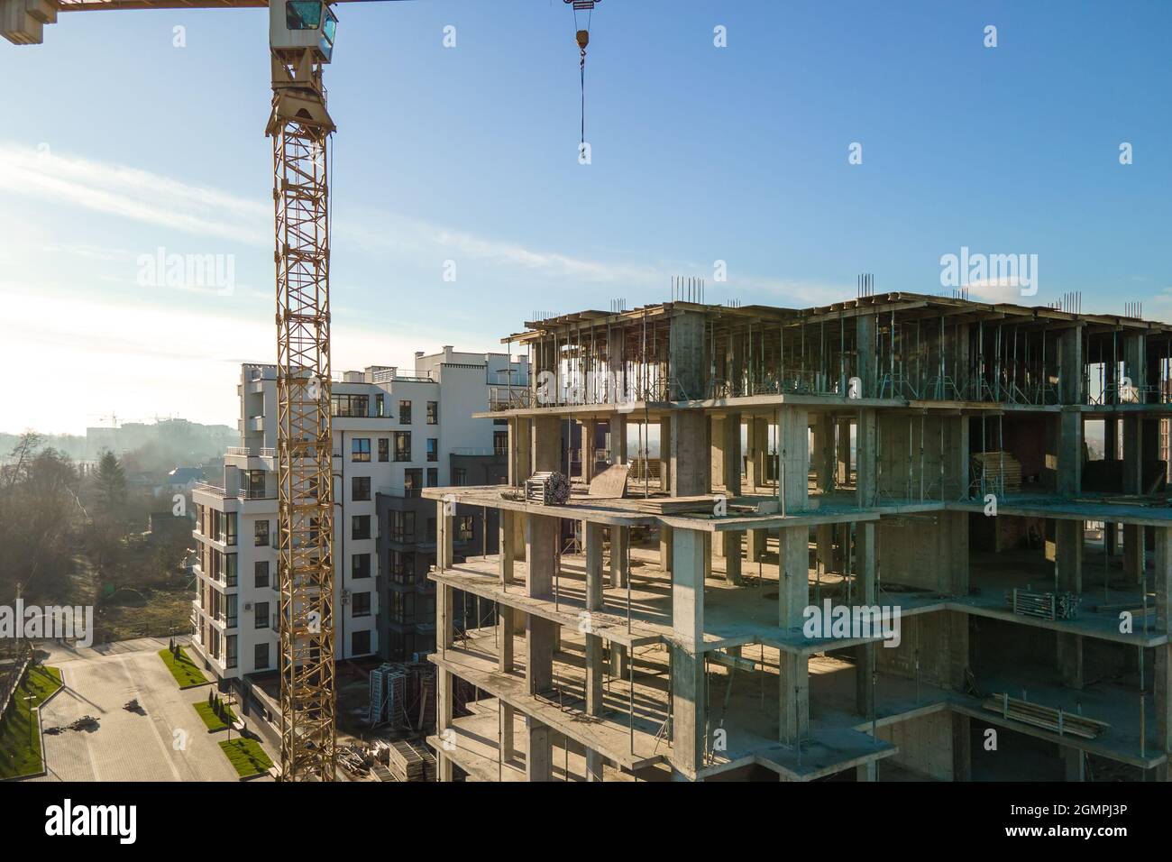 Aerial view of high tower crane and residential apartment buildings ...