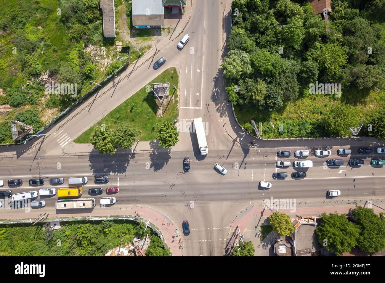 Top down aerial view of busy street intersection with moving cars ...