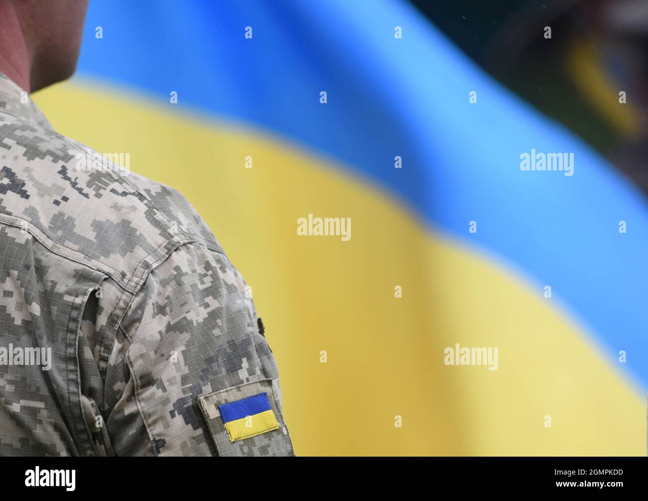 Armed Forces of Ukraine. Ukrainian soldier. Ukrainian in army. Ukrainian flag on military uniform. Stock Photo