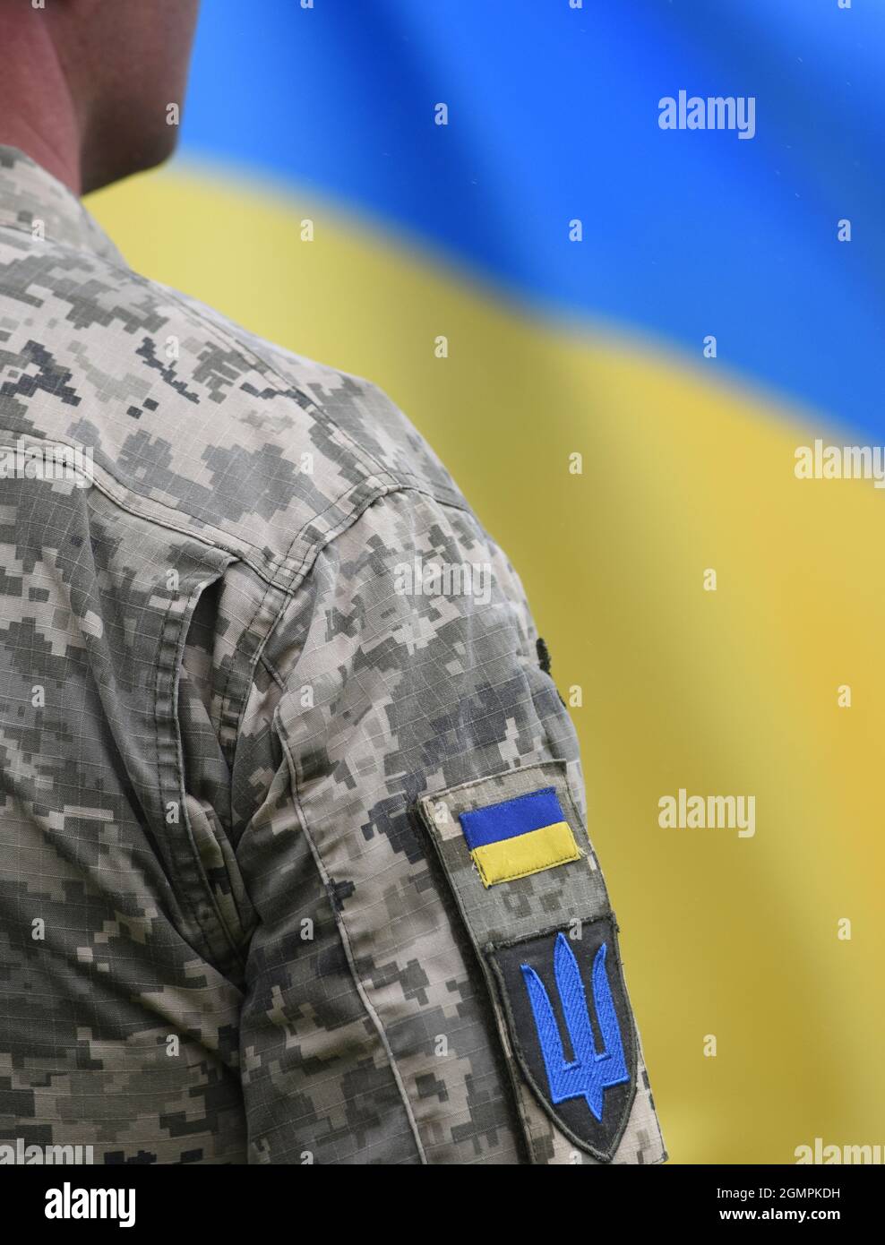 Armed Forces of Ukraine. Ukrainian soldier. Ukrainian in army. Ukrainian flag on military uniform. Stock Photo