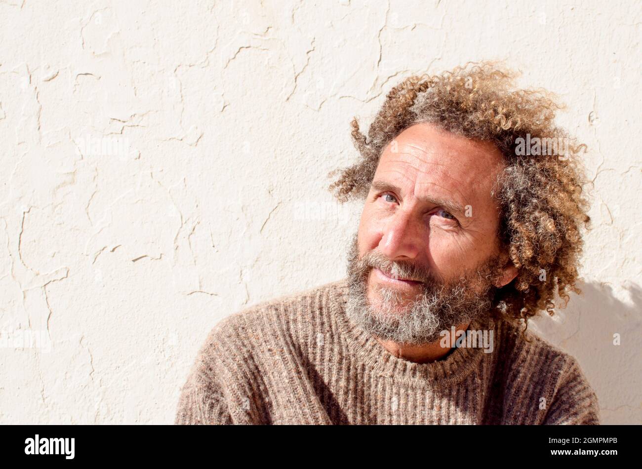 portrait of middle-aged man with clear and shy look Stock Photo