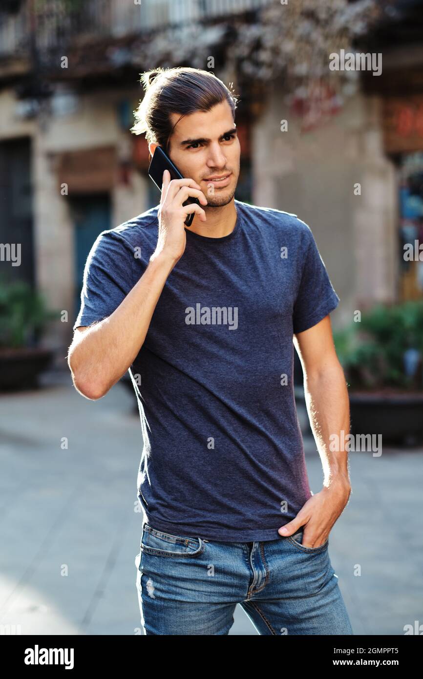 young top model man using smartphone Stock Photo