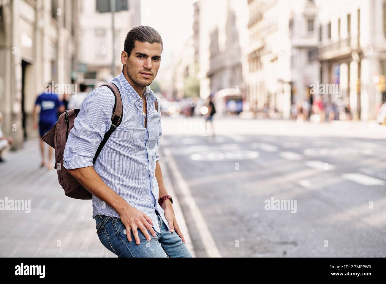 young tourist at Barcelona with backpack at Via Laietana Stock Photo