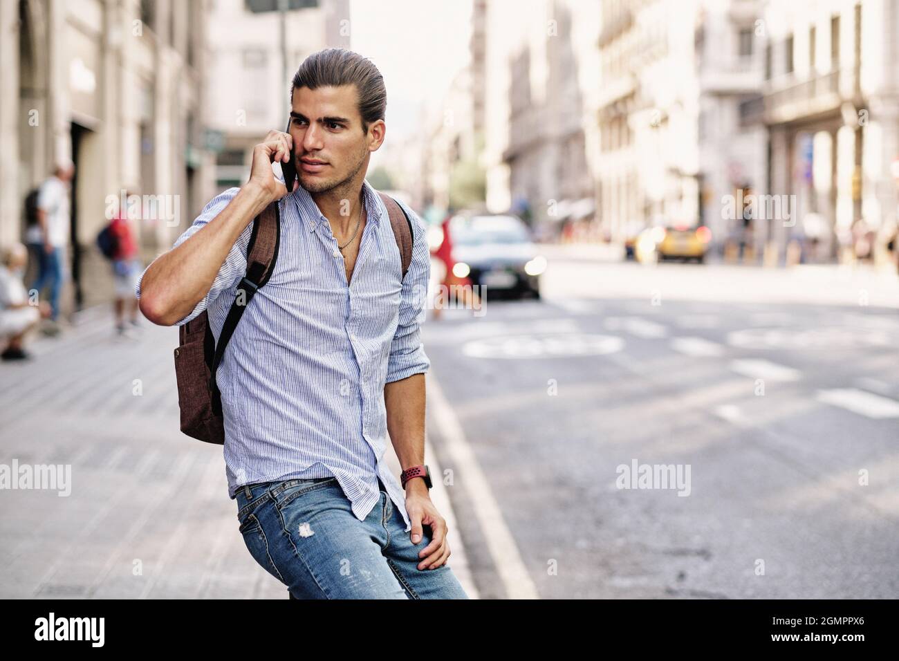 young handsome tourist man using smartphone at Via Laietana - Barcelona Stock Photo