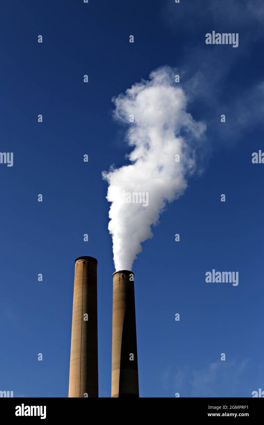 Closeup of smoke coming out of the industrial building Stock Photo