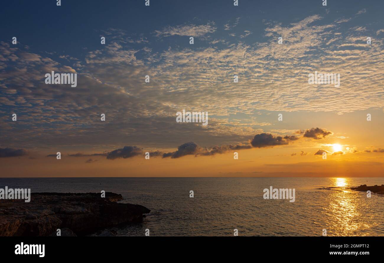 Adriatic sea. Ostuni, Puglia. Sunrise. Renowned seaside resort located in the heart of Salento. This stretch of coast is punctuated by a series of roc Stock Photo