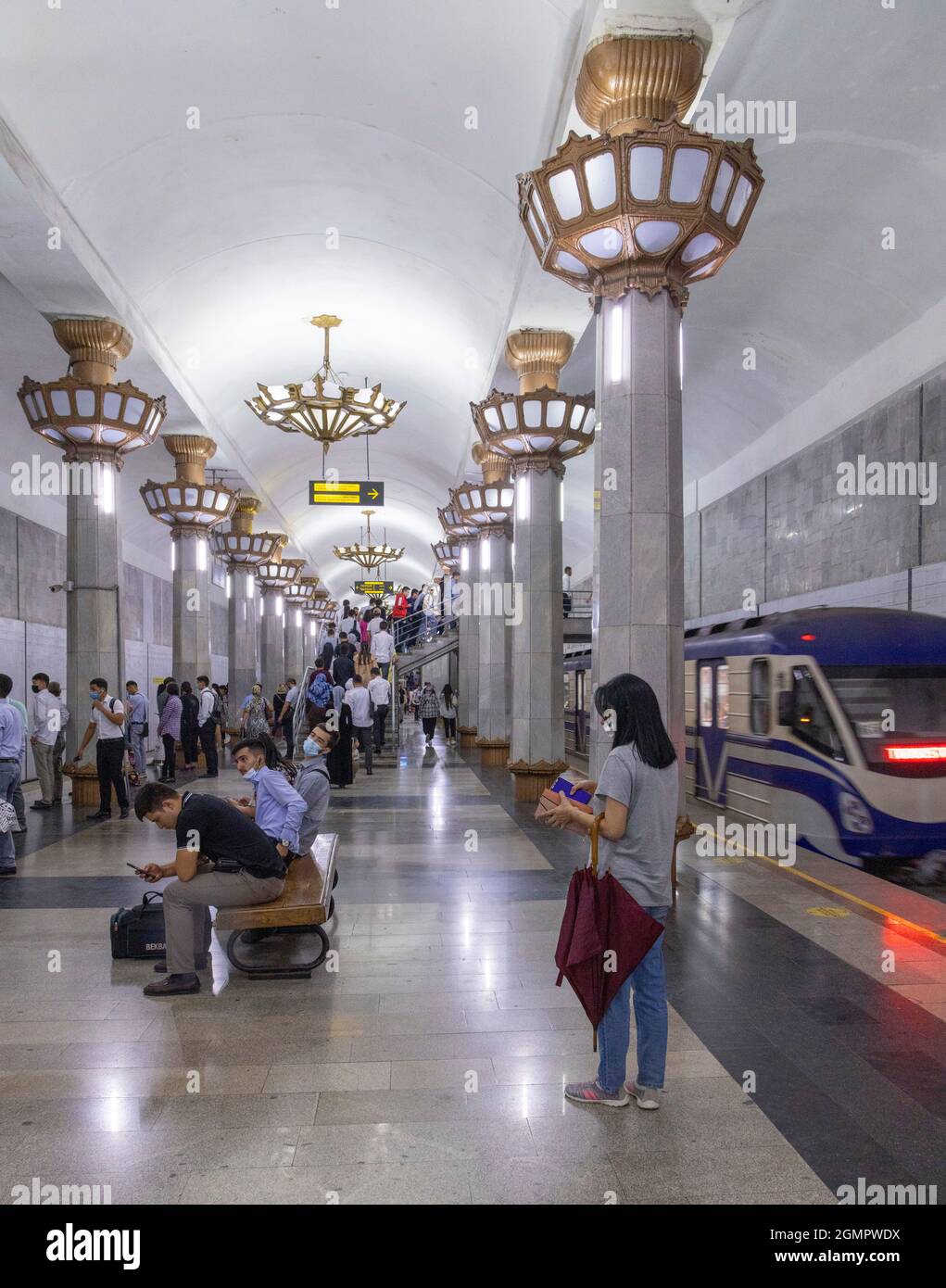 passengers waiting for train at Yunus Rajabiy station, Tashkent metro, Uzbekistan Stock Photo